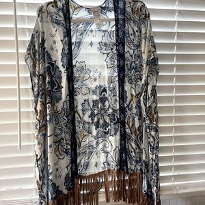 Leather-look Fringed Ruana for spunky cover.